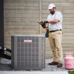 Man working on air conditioner