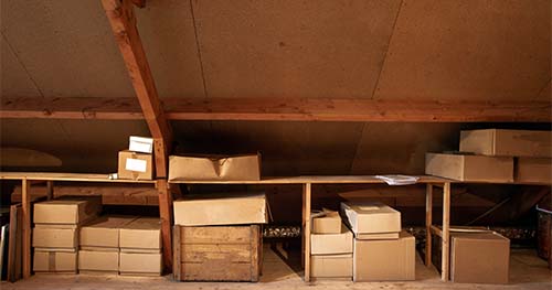 Image: storage shelves built into the attic.