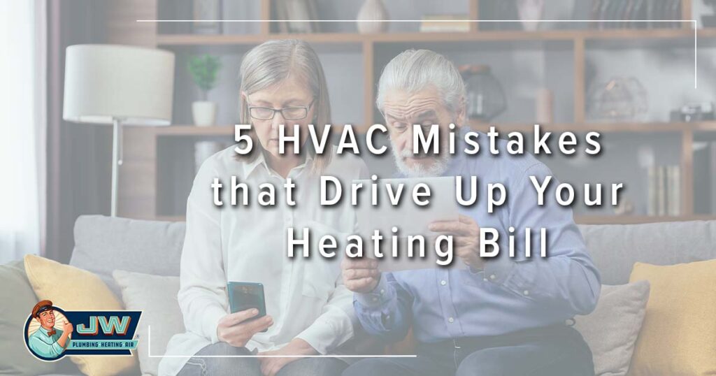 Image: an older couple looks at their bills, cover for 5 HVAC Mistakes that Drive Up Your Heating Bill.
